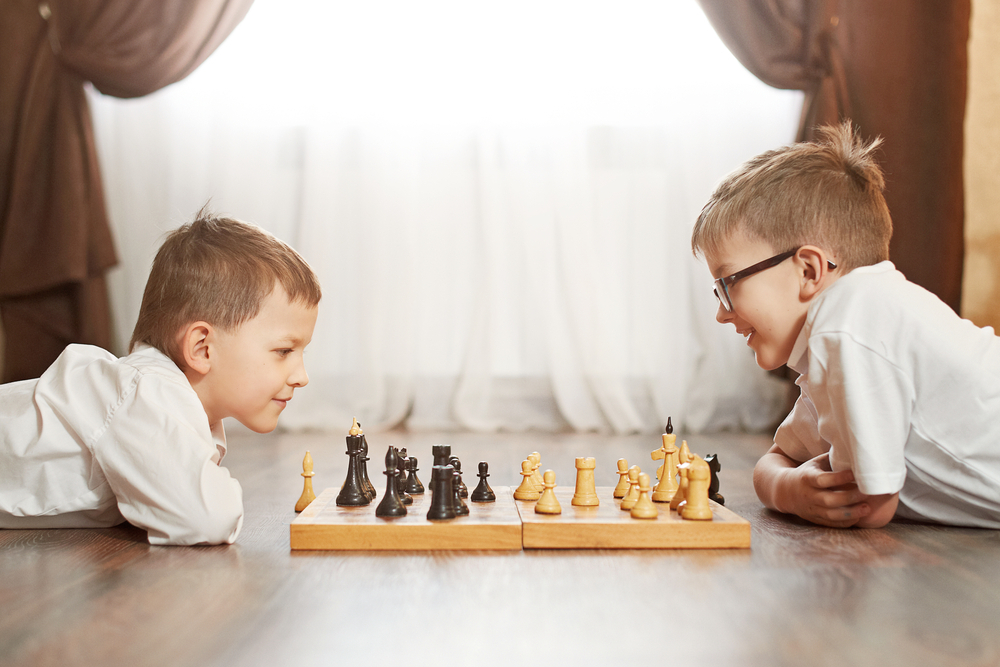 children playing chess game