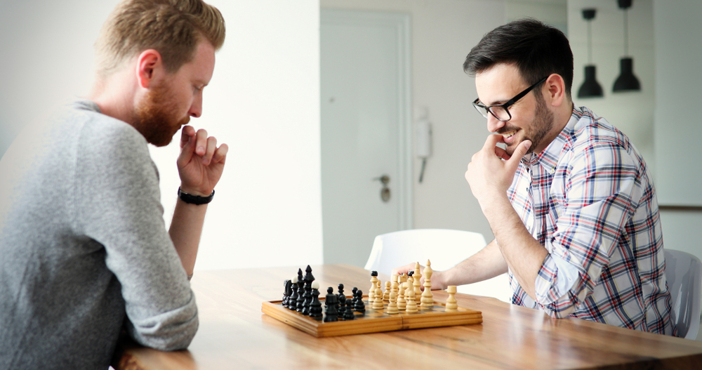 two people playing chess